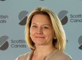 Head shot of Sarah Jane Hannah with the Scottish Canals logo behind her